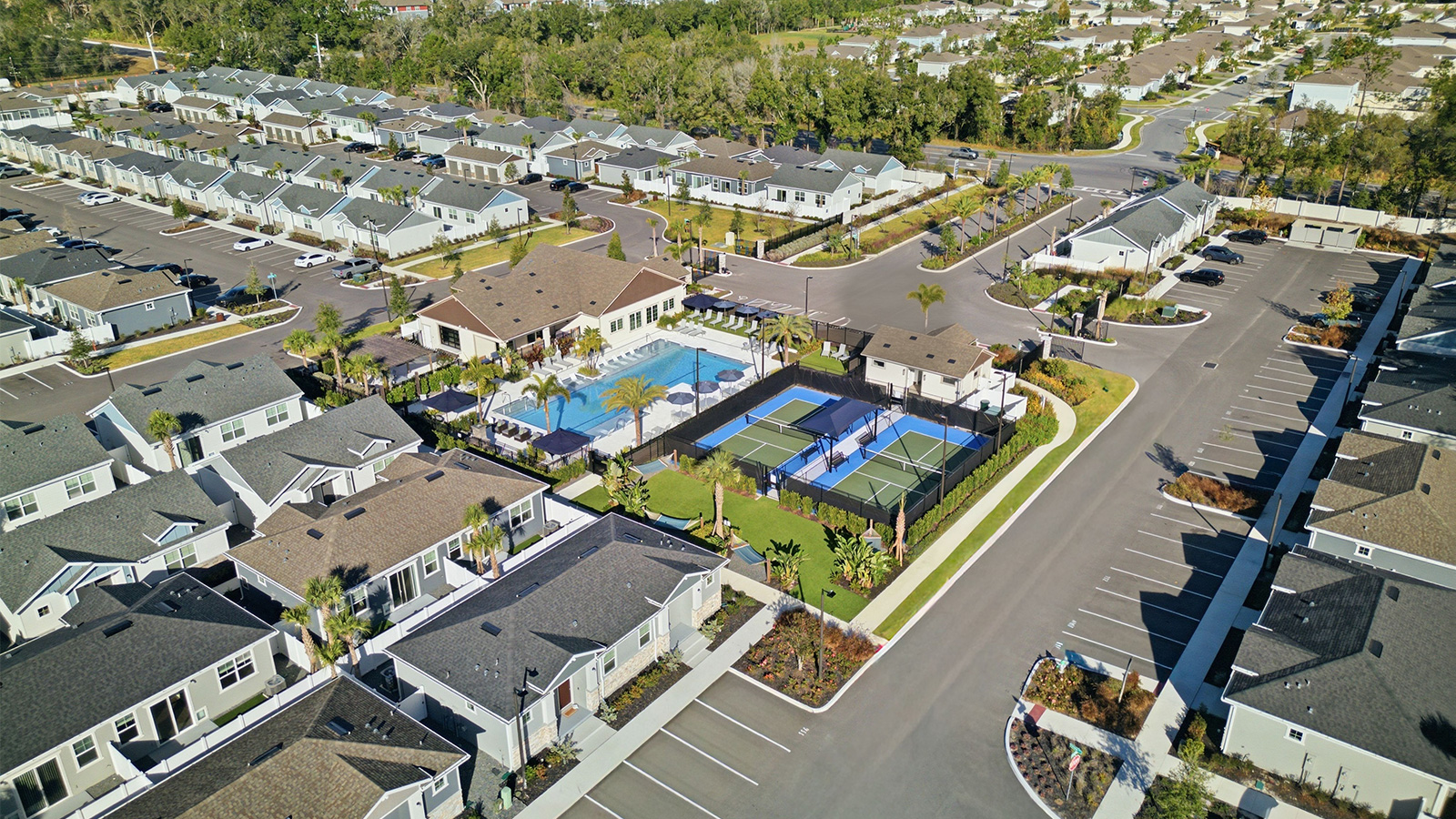 aerial view of Yardly Crossings houses in Deland, FL with pool and pickleball court